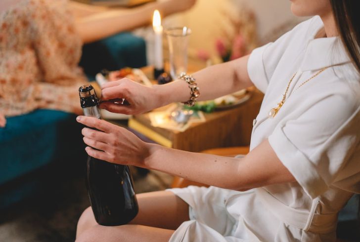 Uncorking a bottle of champagne for a special occasion